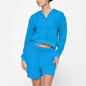 SKIMS French Terry Zip Up Hoodie and French Terry Lounge Short in Mykonos Blue